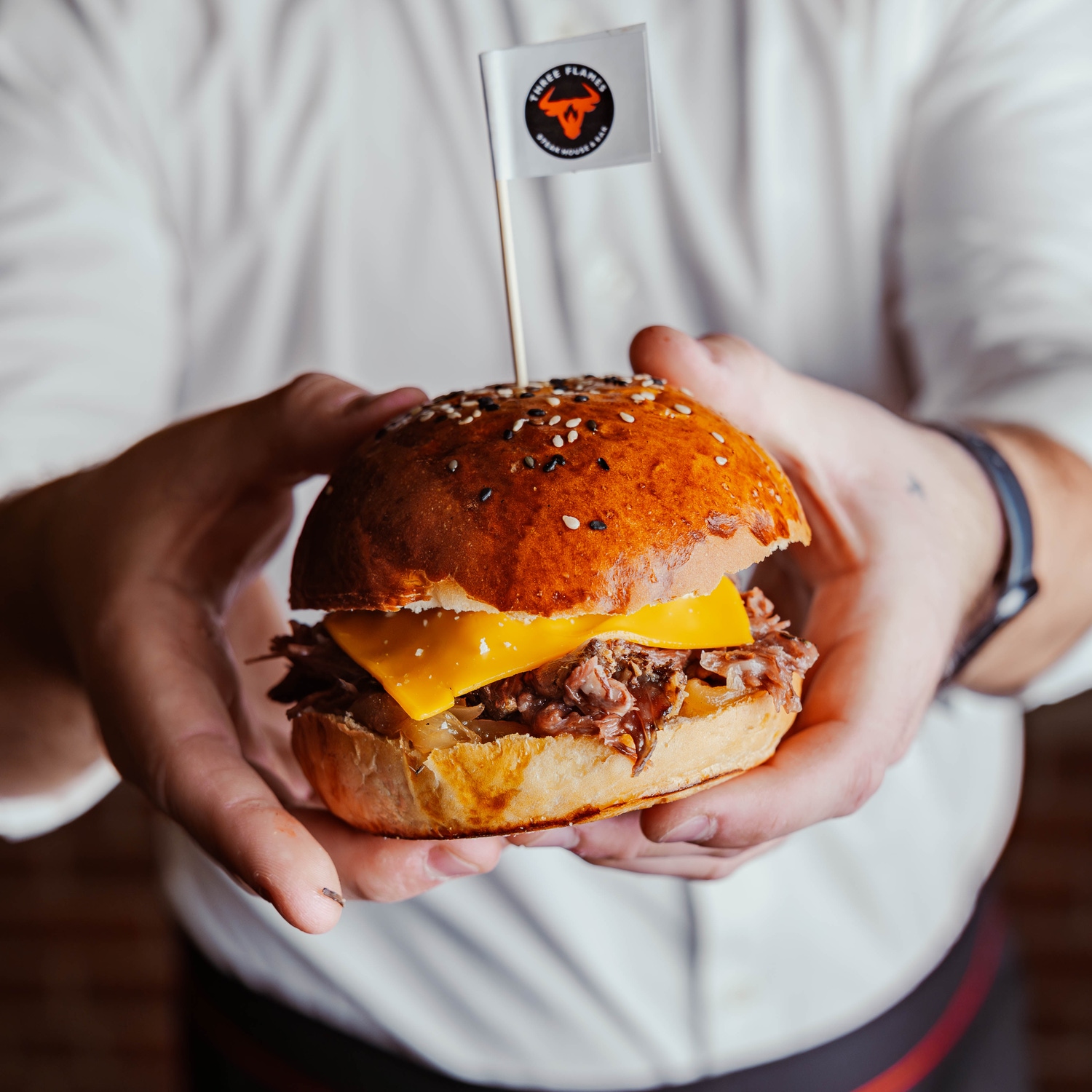 Three Flames burger served with the branded flag