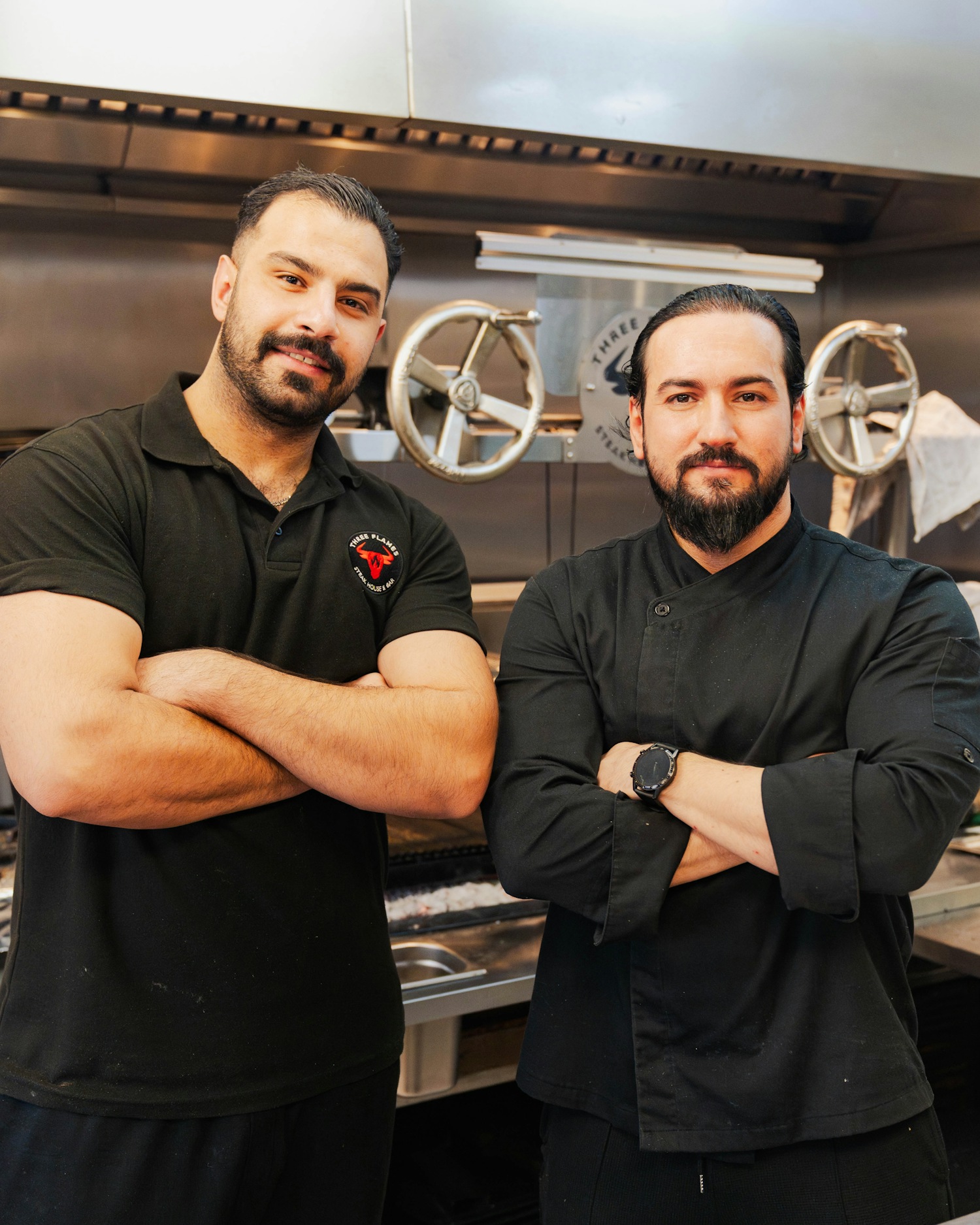 The Three Flames chef team at the charcoal grill